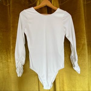 Bodysuit long sleeve white ribbed gathered sleeves at wrist round neckline